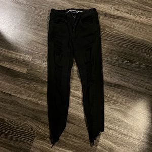 Distressed black jean. American Eagle